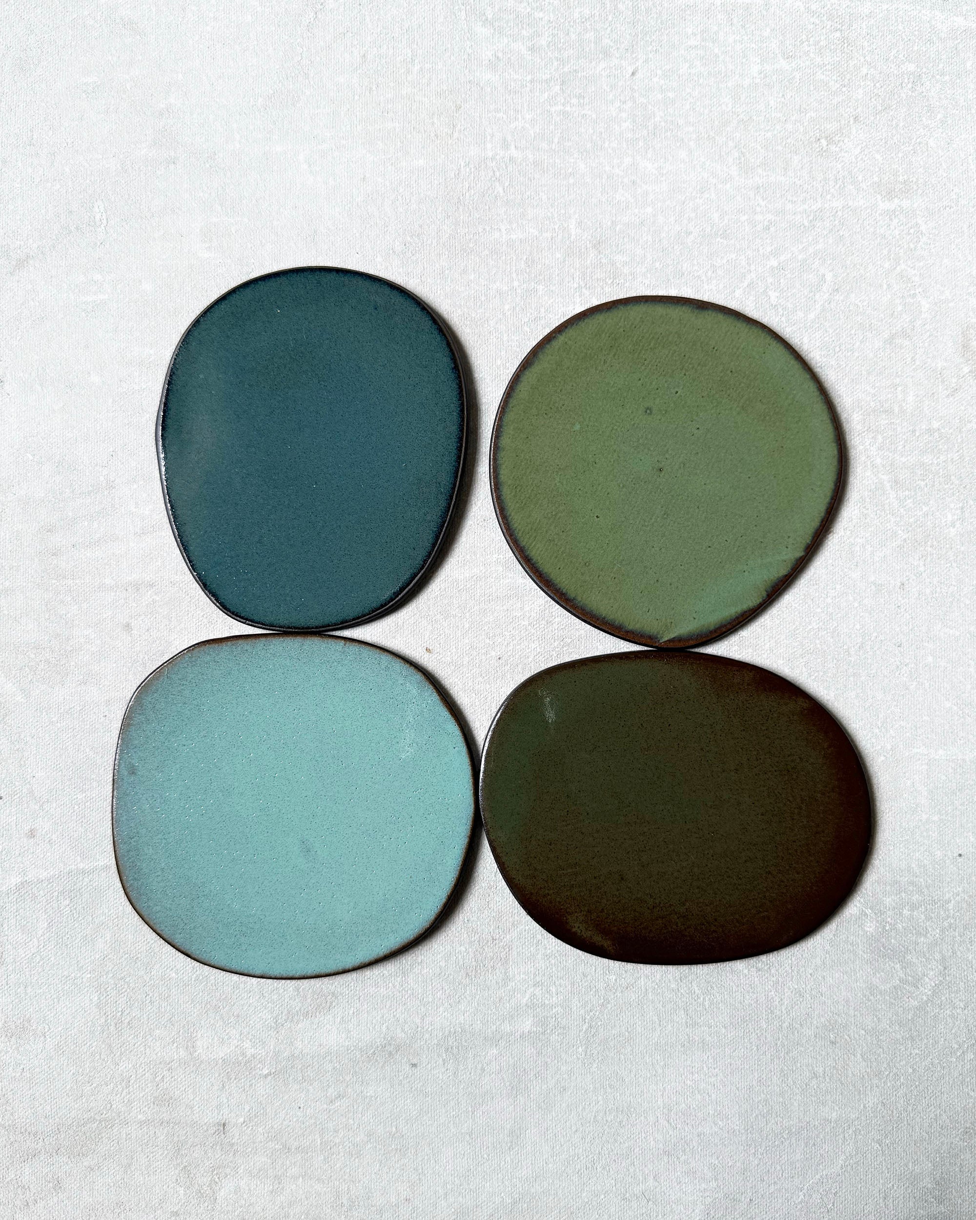 Set of Four Coasters in Greens
